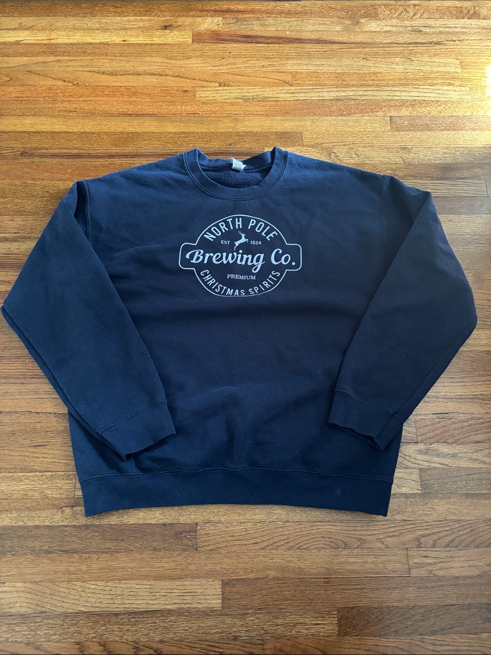 North Pole Brewing Co. Premium Christmas Spirits navy blue crewneck sweatshirt